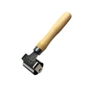 Metal tool with wooden handle on a white background