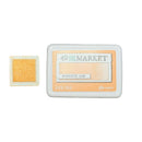 Ranger 49 and Market Honeyed Oak dye ink pad shown with its white plastic casing next to a square sample of the orange-gold ink.