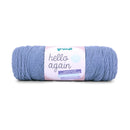 Blue skein of yarn with a label on a white background
