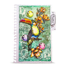 A spiral-bound art journal or planner with a colorful collage-style cover featuring a toucan, flowers, and abstract teal background. A hanging tag on the right reads 'forty four'.