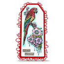 A decorative die-cut tag or label featuring a colorful parrot perched among pink and purple flowers, with the words 'Vibrant Harmony' at the bottom, shown on a plain white background.