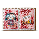 A handmade greeting card with a scalloped white border and brown backing, featuring a whimsical illustrated girl on the left and holiday-themed embellishments including gingerbread cookies, a reindeer, and a banner reading 'baked with love' on the right.