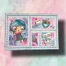 A handmade layered card or craft box featuring a cute cartoon girl with blue yarn hair holding a knitting needle, surrounded by pink and blue scrapbook elements, text stickers reading 'yarn love' and 'just one more stitch', on a pastel pink and blue watercolor background.