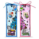 Two handmade Christmas-themed bookmark cards with colorful illustrations of trees, ornaments, envelopes, and playful characters, tied with blue and red ribbons on a white background.