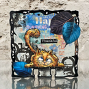 Collage with a cat, leaves, and text on a textured background