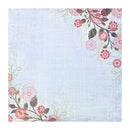 A square decorative cardstock featuring a light blue textured background with a floral border in pink, red, and brown tones in the top-right and lower-left corners.