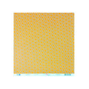 A square sheet of patterned paper featuring a repeating yellow and orange concentric circle design on a light gray background, with a white paper border and small printed text along the bottom edge.