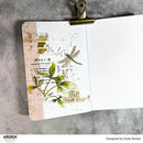 Notebook with artistic design, dragonfly, and text on a gray surface, featuring Arden Creative Studio branding.