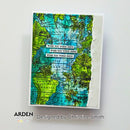 A handmade greeting card featuring a vintage-style world map design with turquoise blue oceans, green landmasses, and a torn-paper effect on the right edge. Three white rectangular labels with black text reading 'WISH YOU WERE HERE' are layered across the center.