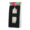 A set of white wooden hair pins arranged in two groups on a black textured fabric card, packaged with a floral header card at the top, shown against a plain white background.