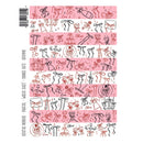 Set of pink washi tape rolls with black and red designs on a white background