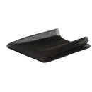 Black mesh fabric filter or mat folded on a plain white background.