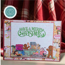A handmade Christmas greeting card featuring gingerbread men, a Christmas kitchen scene, and the text 'HAVE A MERRY CHRISTMAS' in green. The card is displayed in front of a red and white plaid blanket, with a circular stamp brand sticker visible in the top left corner.