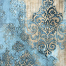 Damask pattern wallpaper featuring distressed blue and beige tones with ornate baroque scrollwork and textured mottled finishes.