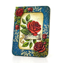 A decorative square picture frame with a vintage aesthetic, featuring a blue script-patterned border, gold filigree details, and raised red roses with green leaves. The center insert displays a vintage-style illustration of a red rose on a cream background with the text 'A Moment in Time'.