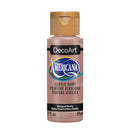 A bottle of DecoArt Americana acrylic paint in the color Whipped Mocha, featuring a metallic pinkish-beige paint inside and a gold cap, shown on a plain white background.