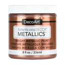 A jar of DecoArt Americana DECOR Metallics bright metallic paint in a copper/bronze shade, with a white lid and white label background.