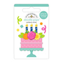 A package of 'doodle-pops' cardstock stickers by Modelling Design Inc., featuring a colorful birthday cake design with three blue candles, pink and yellow flowers, and a mint green stand on a white backing card.