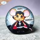 A round craft die-cut sticker or decal featuring a cartoon vampire mouse wearing a black cape and suit with pink inner ears, set against a dark starry background with the words 'HAPPY HAUNTING!'. The brand logo 'Elizabeth craft designs' is visible in the top-left corner.