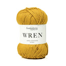 A skein of mustard yellow yarn with a white paper label reading 'fiddlesticks knitting yarns WREN 100% COTTON 8 PLY'.