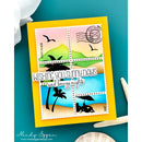 A handmade greeting card featuring a yellow border and six colorful postage-stamp-style panels with beach and sky scenes, plus the text 'WISHING YOU SUNNY DAYS and breezy nights.' The card is photographed on a teal surface with decorative props around it.