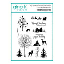A sheet of Gina K. Designs 'Snowy Silhouettes' photopolymer stamps, featuring black holiday-themed silhouettes including trees, houses, reindeer, Santa Claus, and festive phrases on a white background with a teal border.