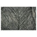 A close-up of variegated yarn strands in a heathered dark gray and off-white colorway, arranged in a V-shaped pattern.