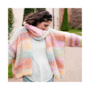 Person wearing a colorful scarf with a blurred outdoor background