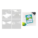 Set of mountain-themed stencils and a printed card on a white background