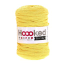 A skein of bright yellow yarn with a white paper label reading 'Hookey RIBBONXL' on a plain white background.