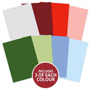 A set of eight flat color cards arranged in a fan shape on a white background, with a red circular badge at the bottom reading 'INCLUDES 3 OF EACH COLOUR'. The colors include white, dark red, bright red, light pink, dark green, light green, light blue, and sky blue.
