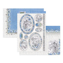 A set of winter-themed scrapbooking papers and sticker sheets featuring blue and white birdhouse and snowy landscape designs, arranged on a plain white background.