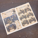 Open book with illustrations and text on a wooden surface