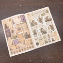 Sheet of decorative stickers with fairy designs on a wooden surface