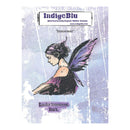 IndigeBlu 'Innocent' rubber stamp card featuring a stylized illustration of a fairy with purple wings and a purple dress on a distressed lavender background.