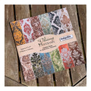 A packaged paper pack labeled 'Delicious Barnask' with multiple damask patterned paper designs visible, placed on a rustic wooden surface. The package includes designs in mustard, red, green, blue, orange, and brown tones.