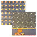 A square decorative paper sheet featuring a Halloween-themed design with a dark gray starry background, orange pumpkins, yellow circular accents, and a collage of vintage-style text and illustrations at the bottom.