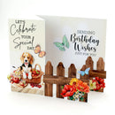 Birthday card with a dog, flowers, and butterflies on a white background