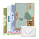 Set of greeting cards with various designs and a white envelope on a white background