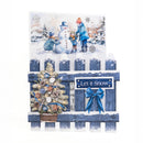 A decorative winter-themed card or art print featuring a snowy scene with children building a snowman, a blue picket fence, a small ornamented tree, and a blue bow with a sign reading 'Let it Snow'.