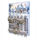 Christmas card with snowy village scene, snowman, and decorative elements.