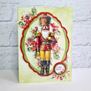 Christmas card with a nutcracker design on a light green background