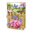 Greeting card with a garden scene, pink flowers, and butterflies on a white background.