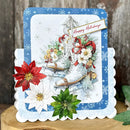 Christmas card with sleigh, poinsettias, and 'Happy Holidays' text on a wooden surface.