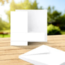White square on a wooden surface with a blurred natural background