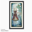 Framed vertical art print featuring a whimsical vintage dress illustration with layered text and decorative elements on a blue textured background, shown in a black frame against a light gray backdrop. Text at bottom left reads 'Created by Tracey Dutton'.