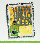 A handmade Halloween greeting card featuring glittery green layered letters spelling 'HAPPY HALLOWEEN' over a yellow and orange spiderweb background, with a green potion bottle illustration and a scalloped white border.
