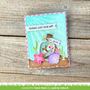 A handmade layered card featuring an underwater theme, displayed on a rustic wooden background. The card has a turquoise water background, a pink and white striped border, a message in a bottle with a 'Miss You' banner, a pink starfish, a purple seashell, and a brown sand base.