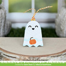A cute ghost-shaped ornament with a smiling face and a small orange pumpkin, hanging from a yellow-and-white striped string on a wooden surface.