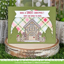 A handmade Christmas greeting card displayed on a rustic wood slice with greenery in the background. The card features an olive green base, a gingerbread house design, holiday plaid accents, and a white banner reading 'HAVE A SWEET CHRISTMAS! FROM OUR FAMILY TO YOURS'.